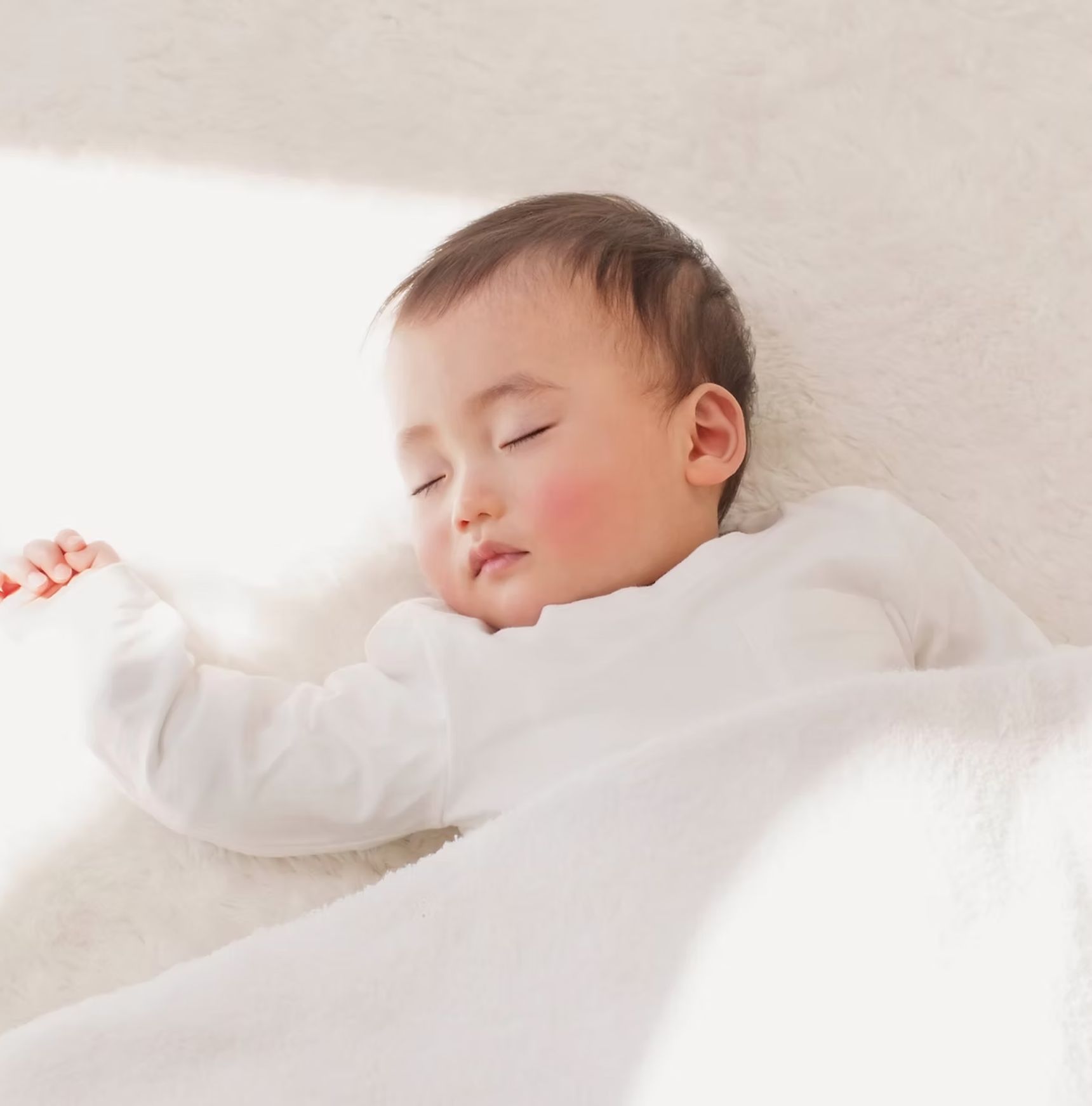 a baby in a crib, resting peacefully