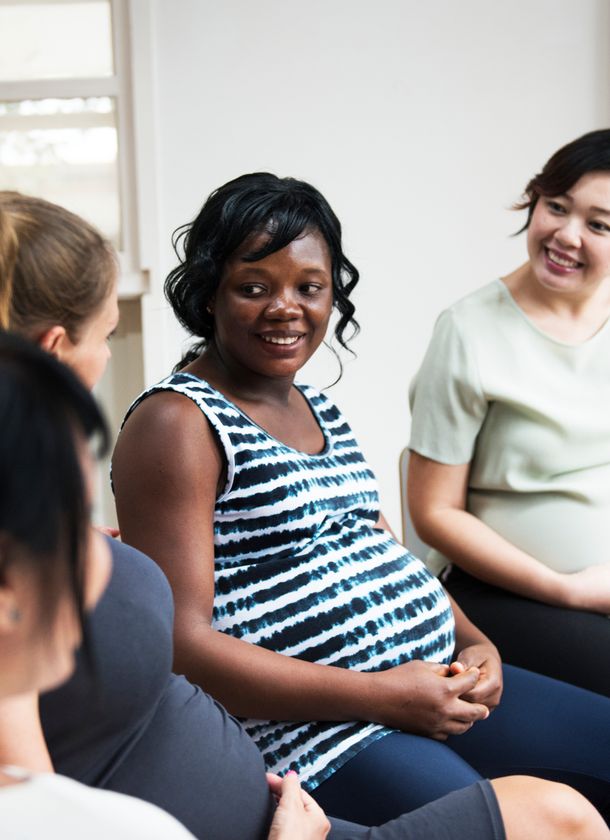 a group of pregnant ladies sitting in a circle