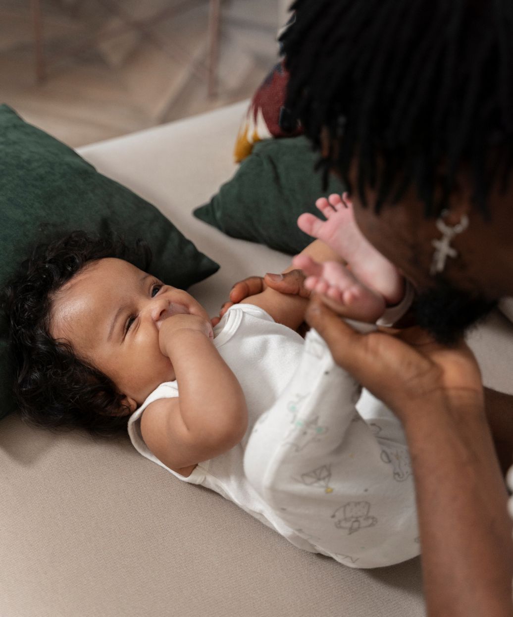 A doula playing with a baby