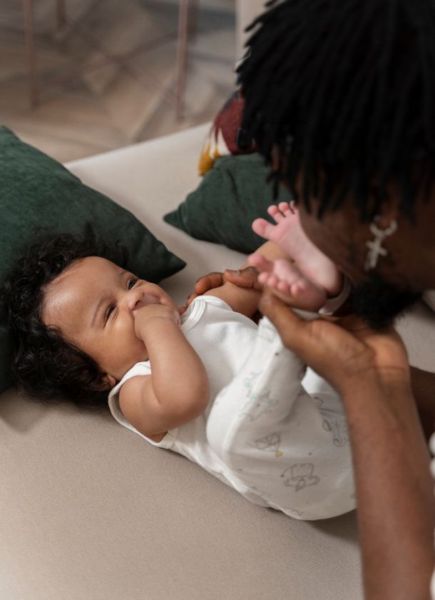 a doula playing with a baby